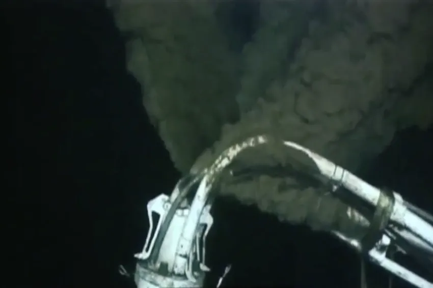 spewing oil from broken well